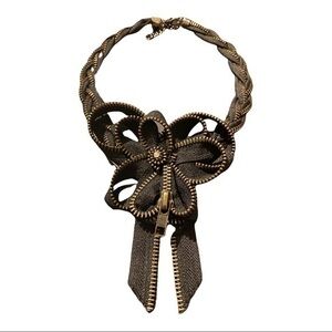 Necklace made entirely out of zippers.